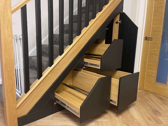 Under Stair Storage with Black Panelling